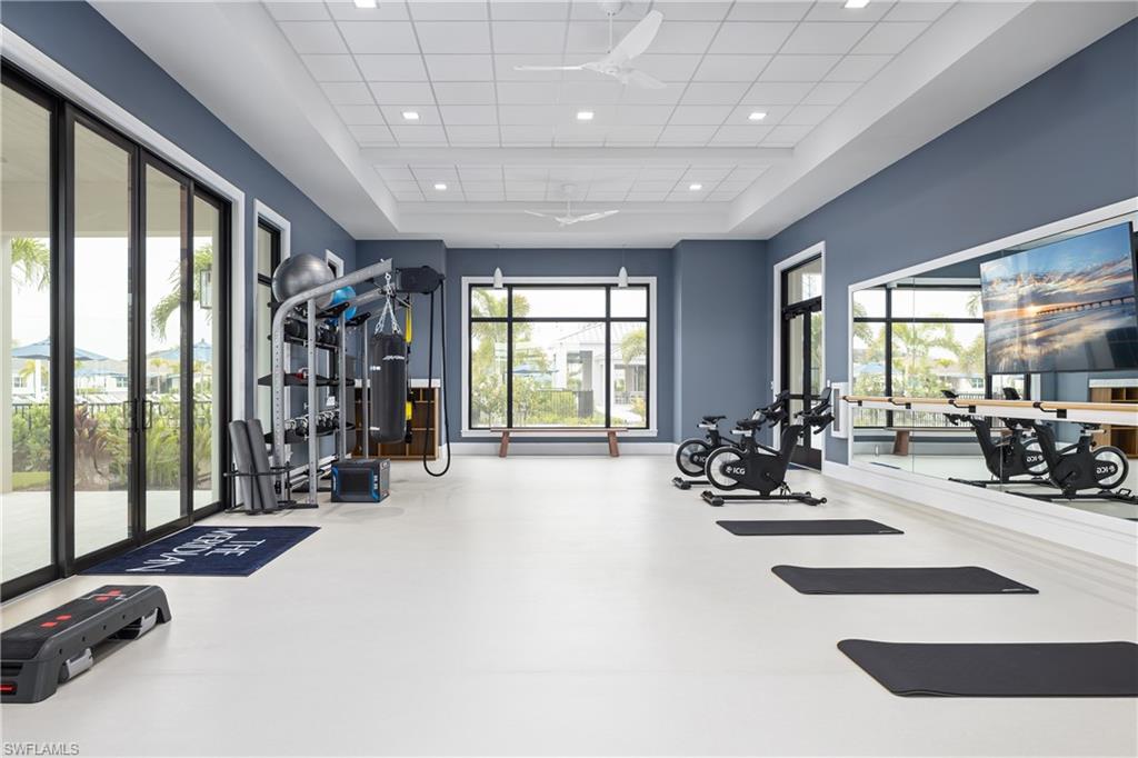 8775 Oceana Way Naples, FL 34114 - Photo 24 of 30 a view of a room with gym equipment