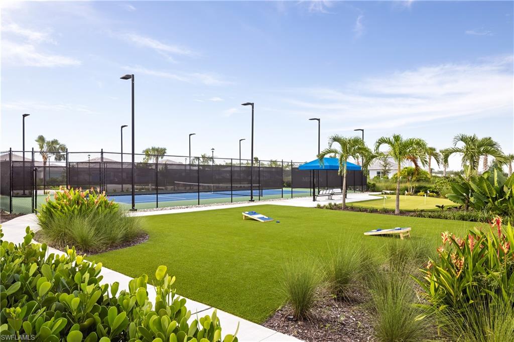 8775 Oceana Way Naples, FL 34114 - Photo 29 of 30 a view of a garden with lawn chairs