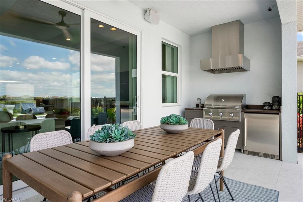 8775 Oceana Way Naples, FL 34114 - Photo 9 of 30 a kitchen with a table and chairs