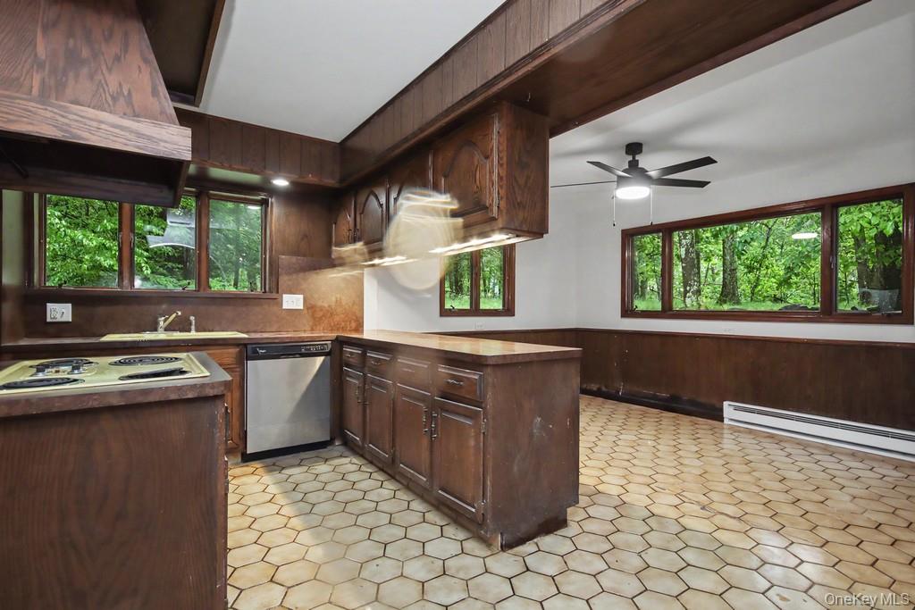 18 Hillside View Road Mahopac, NY 10541 - Photo 22 of 42 a kitchen with stainless steel appliances granite countertop a stove a sink and a microwave