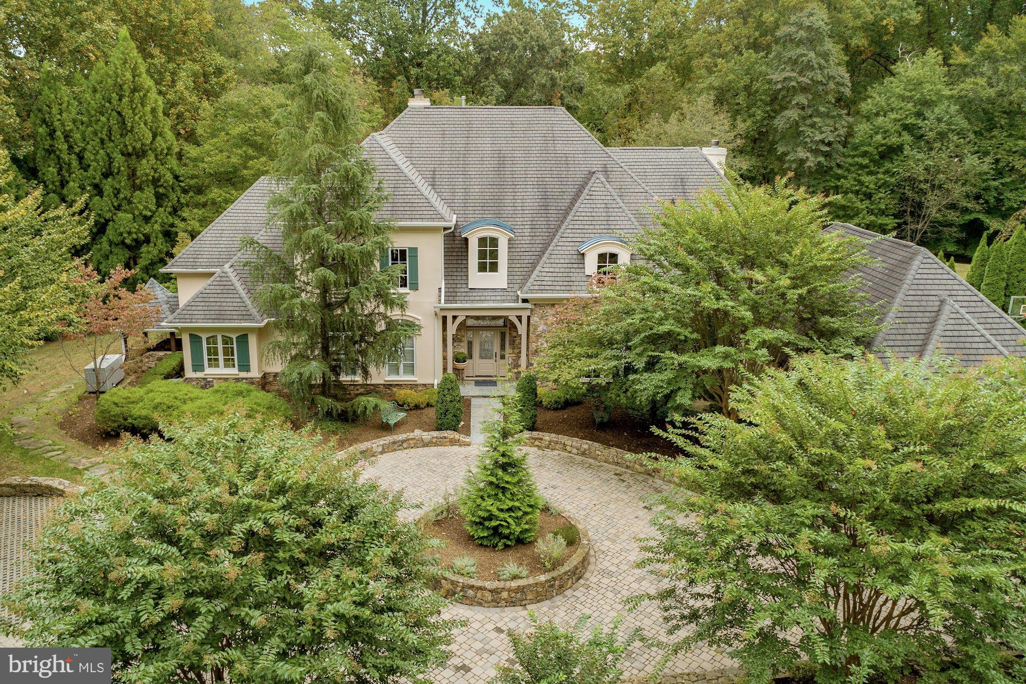 337 Springvale Road Great Falls, VA 22066 - Photo 1 of 120 a aerial view of a house with a yard and fountain in middle