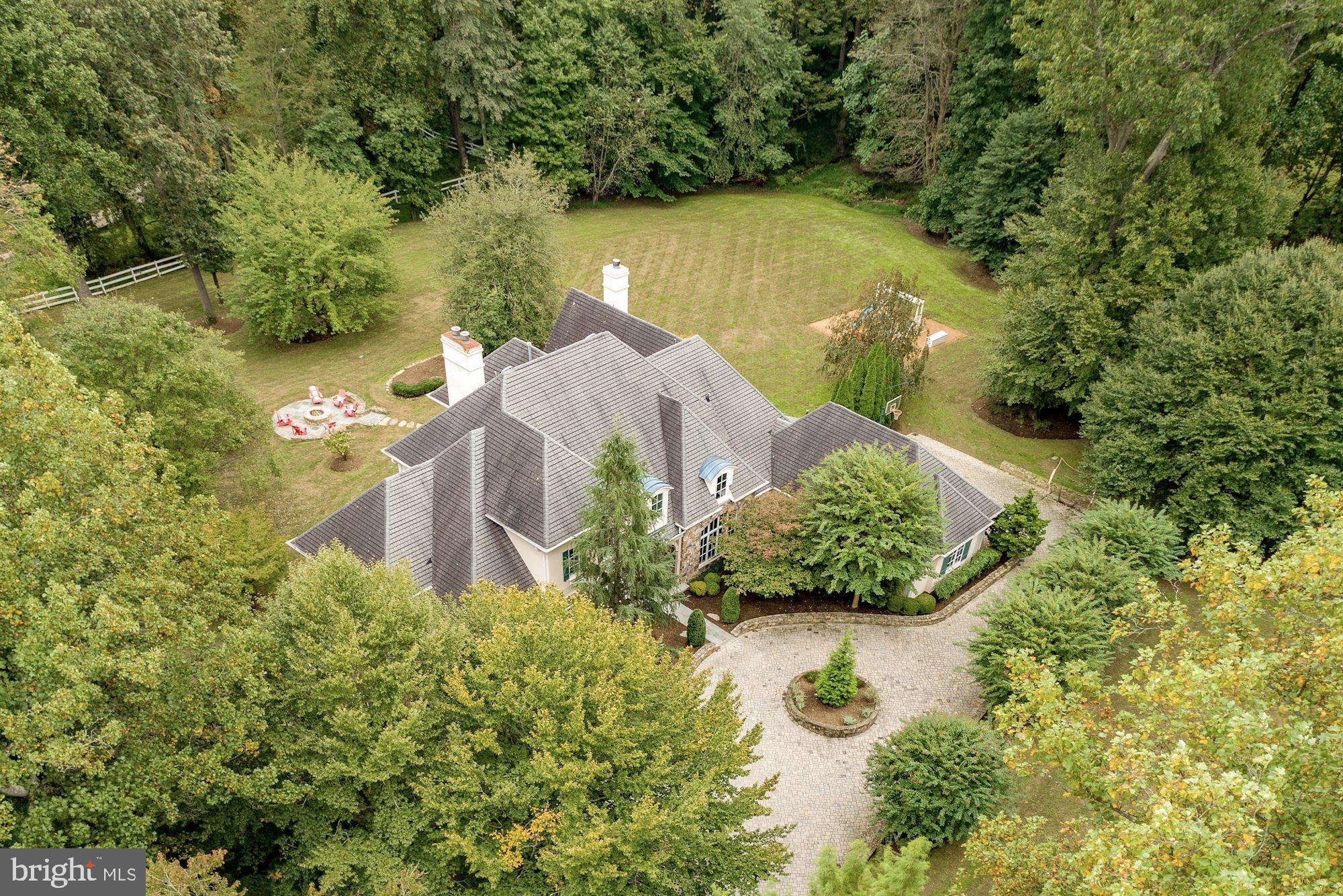 337 Springvale Road Great Falls, VA 22066 - Photo 107 of 120 an aerial view of a house with a yard and lake view