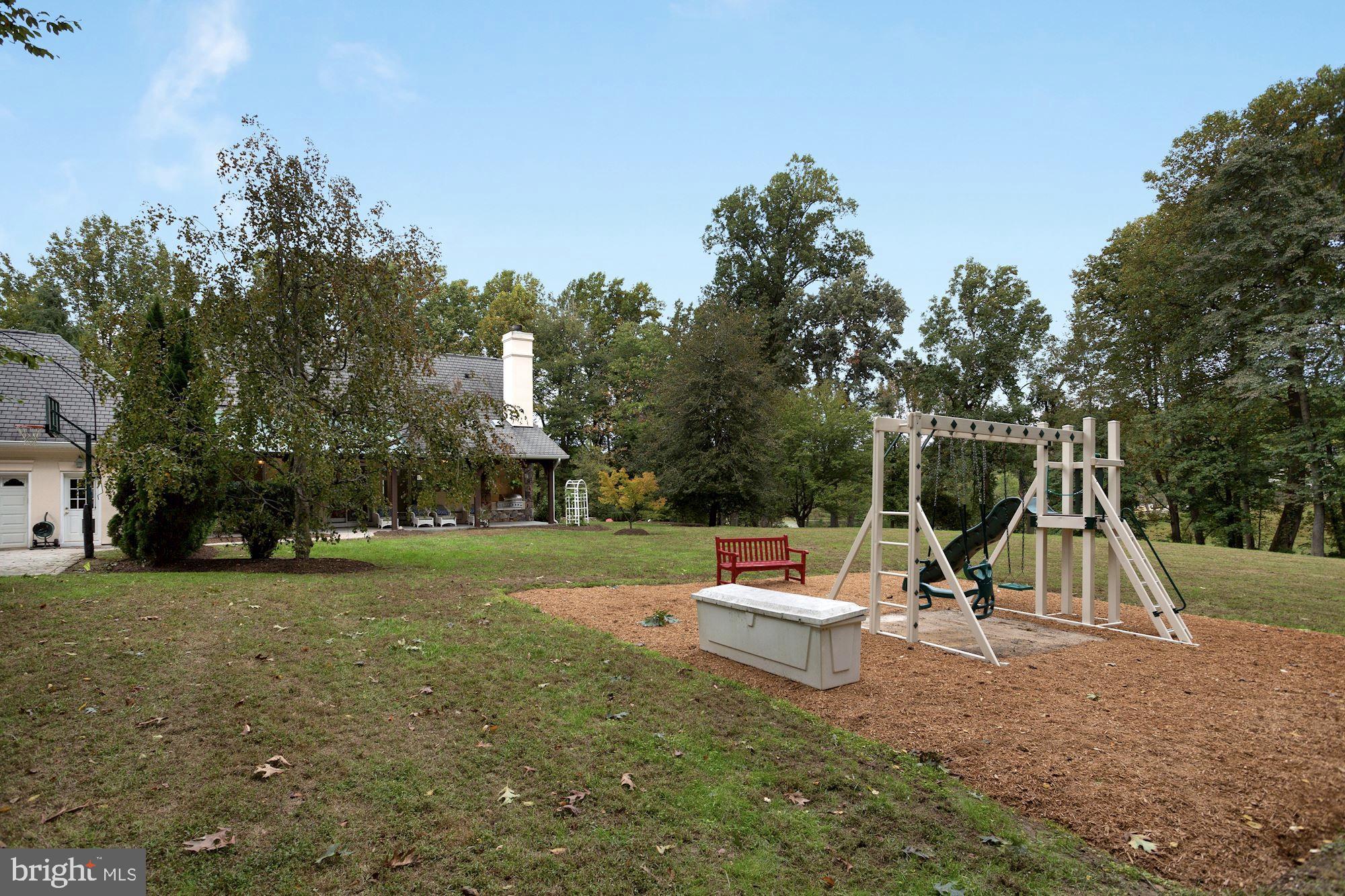 337 Springvale Road Great Falls, VA 22066 - Photo 111 of 120 a view of a park with swings and slides