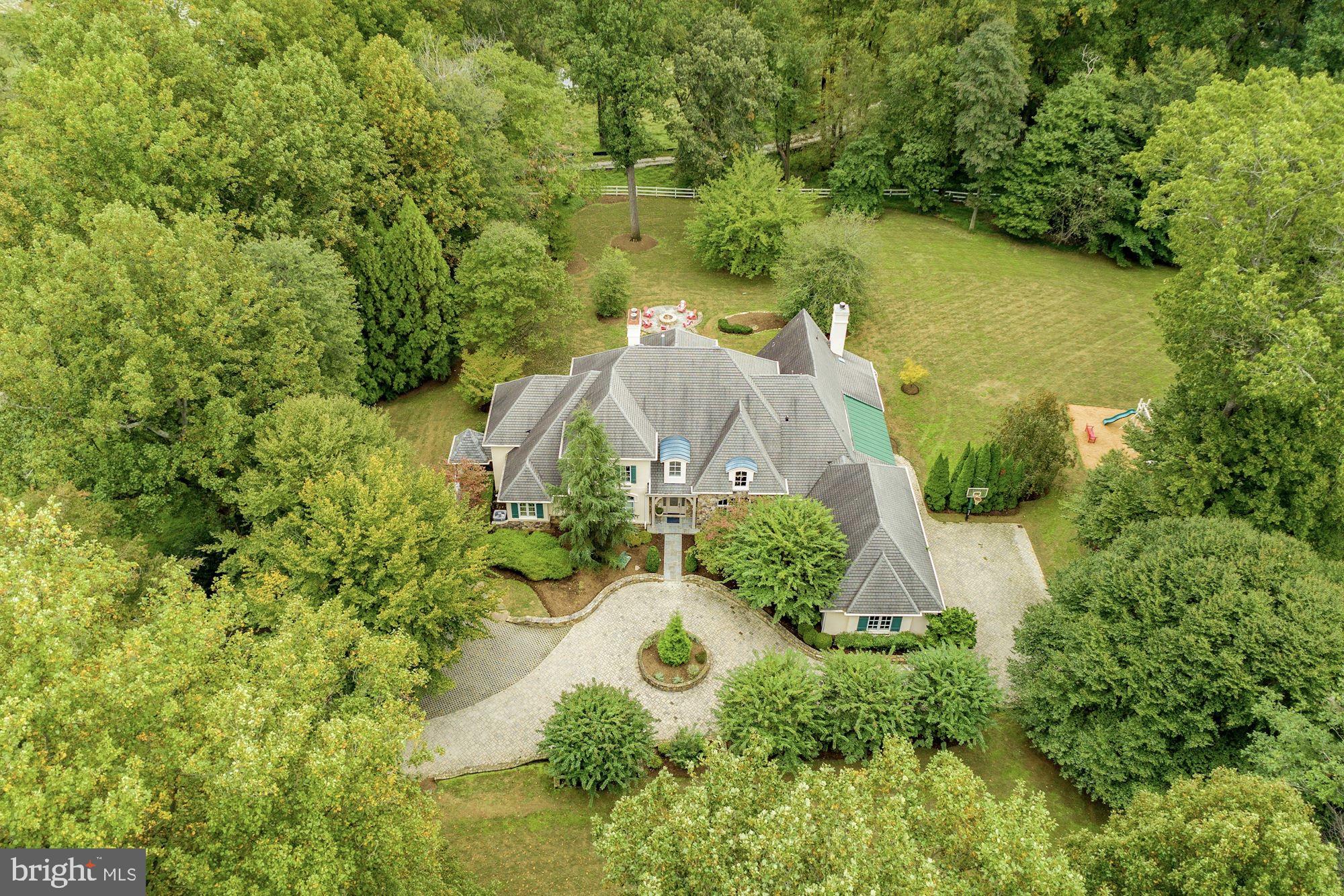 337 Springvale Road Great Falls, VA 22066 - Photo 3 of 120 an aerial view of a house with a yard and lake view