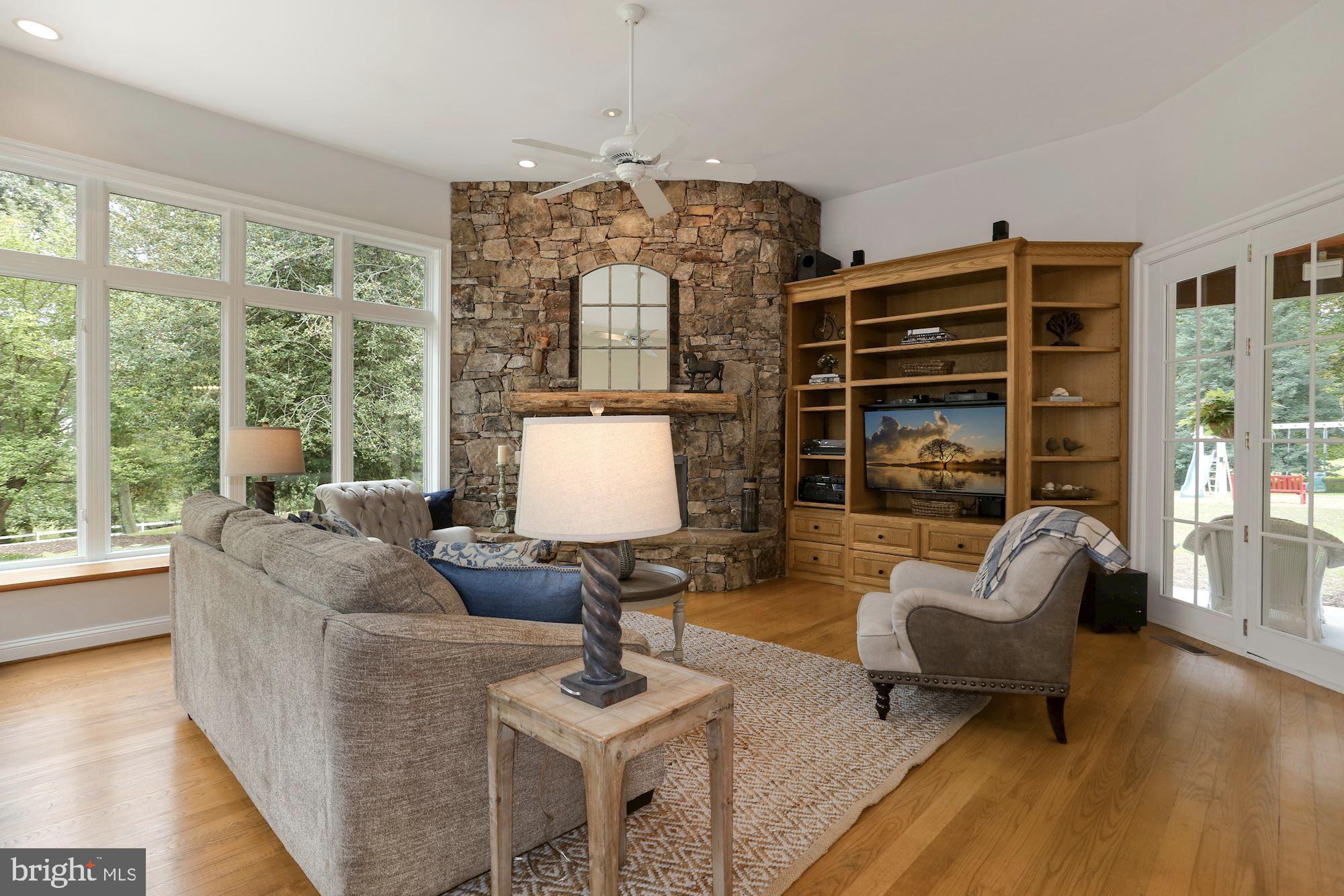 337 Springvale Road Great Falls, VA 22066 - Photo 33 of 120 Wood burning fireplace with stone surround
