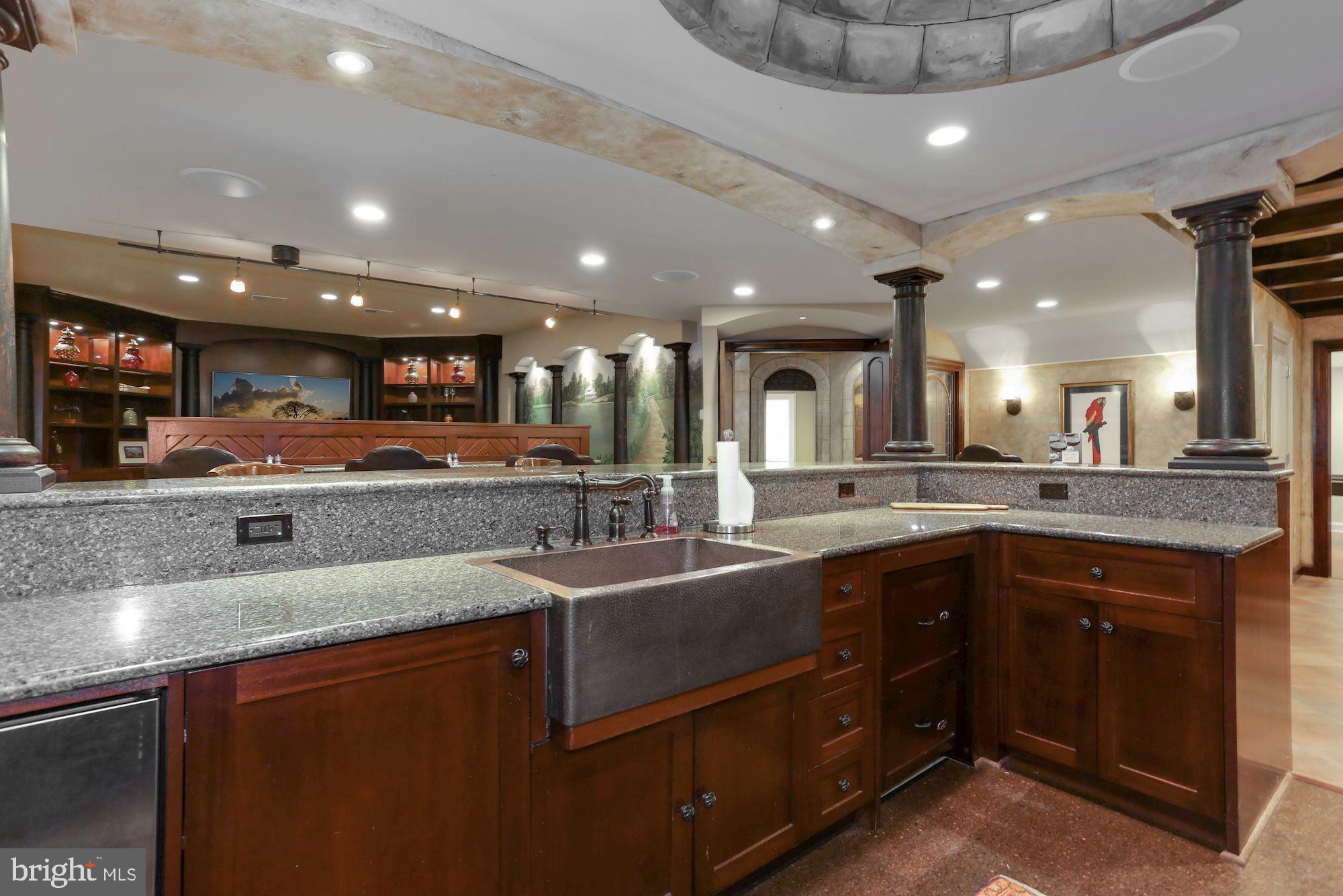 337 Springvale Road Great Falls, VA 22066 - Photo 61 of 120 a large kitchen with stainless steel appliances and a sink