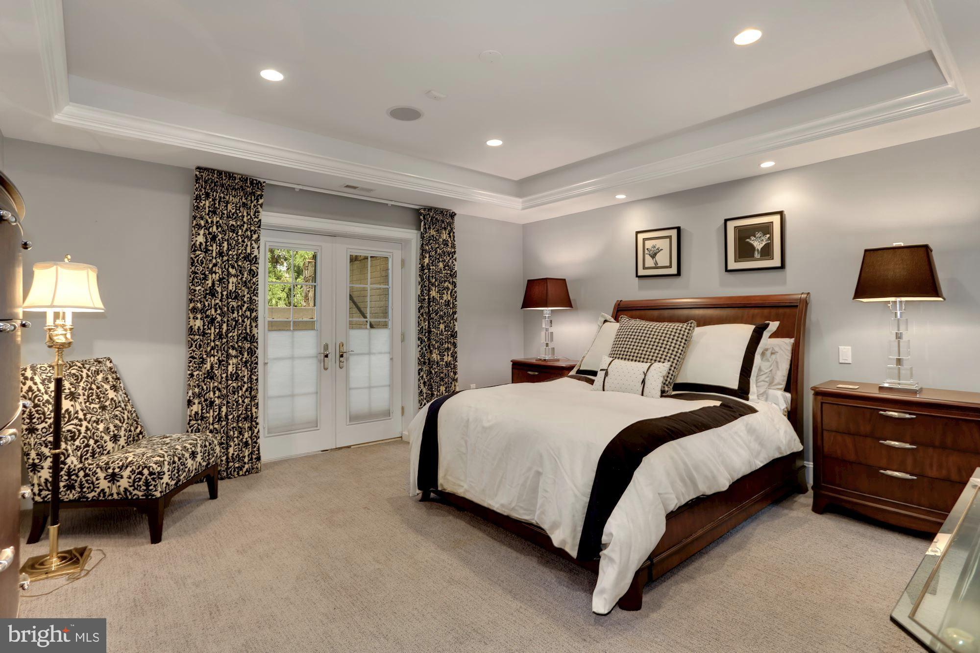 337 Springvale Road Great Falls, VA 22066 - Photo 69 of 120 a spacious bedroom with a bed and a couch