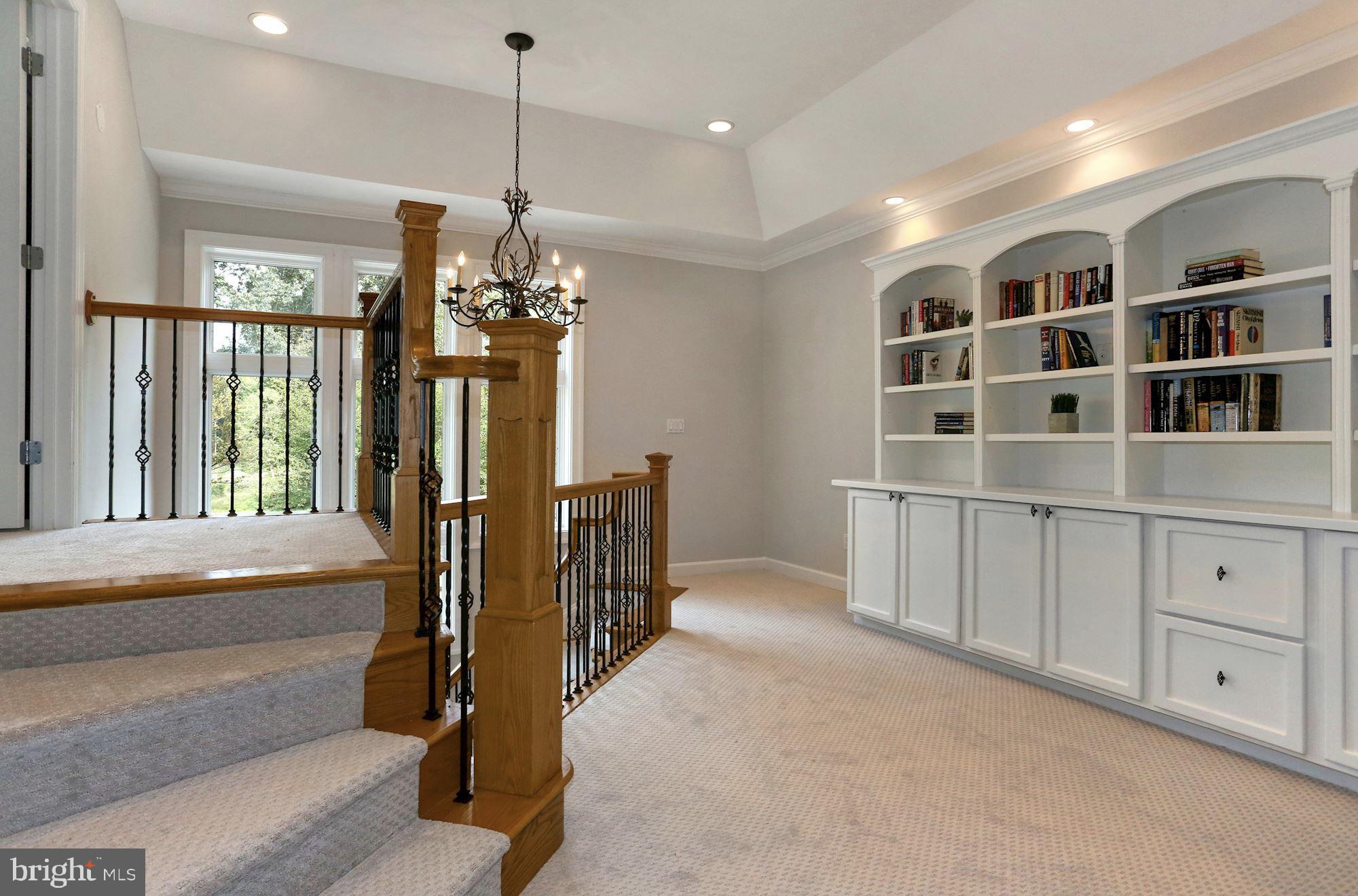 337 Springvale Road Great Falls, VA 22066 - Photo 73 of 120 a view of a hallway with windows and chandelier