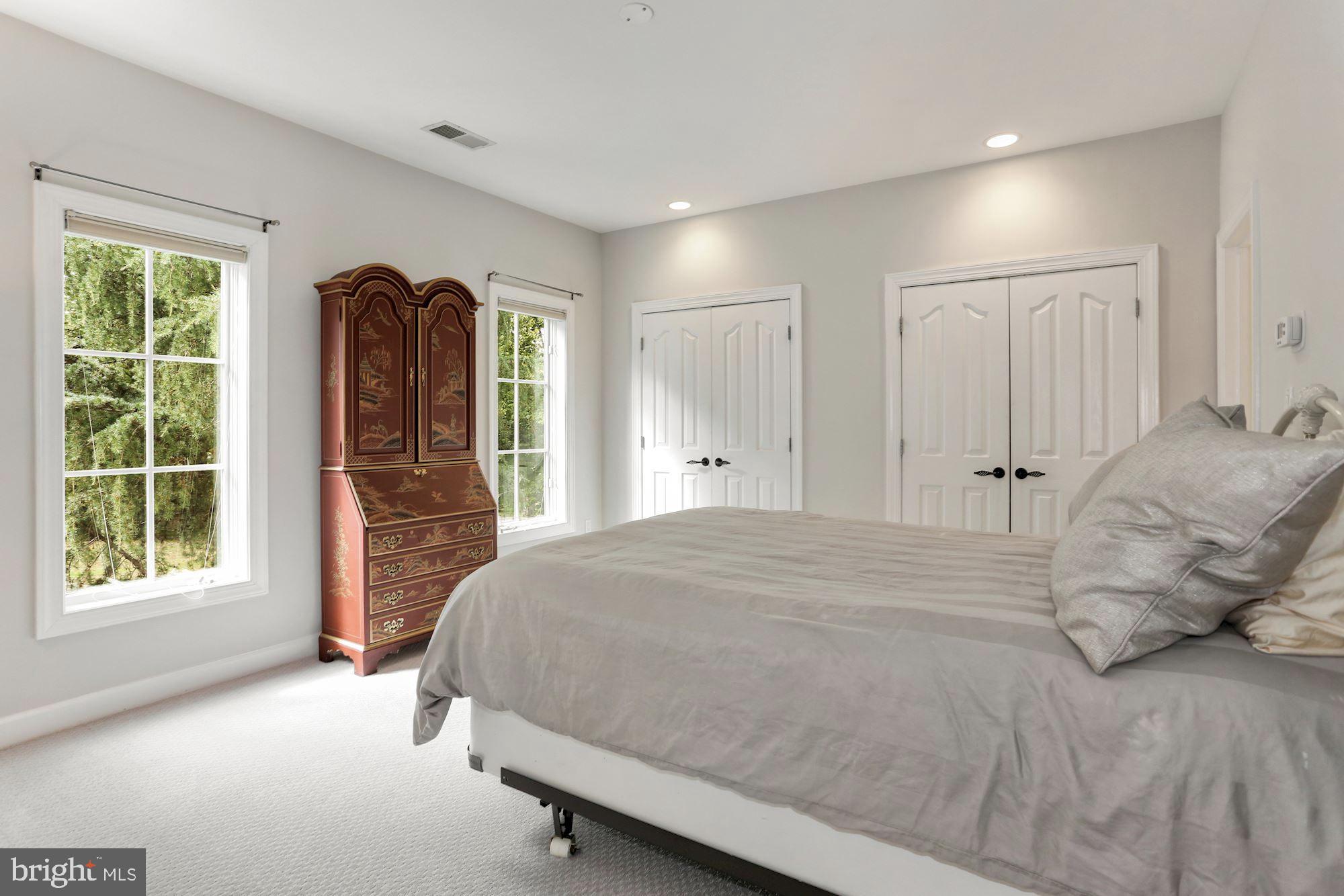 337 Springvale Road Great Falls, VA 22066 - Photo 79 of 120 a spacious bedroom with a bed and a large window