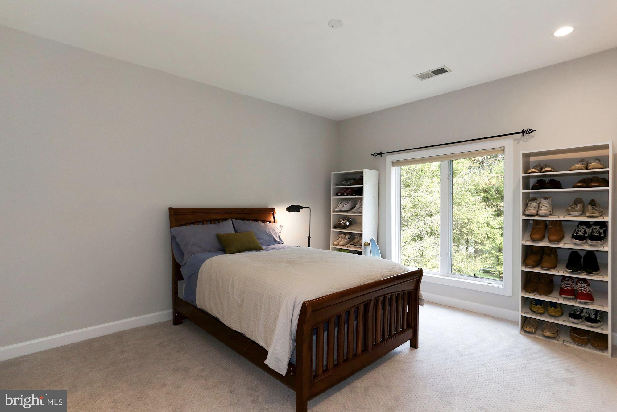 337 Springvale Road Great Falls, VA 22066 - Photo 82 of 120 a bedroom with a bed window and a closet
