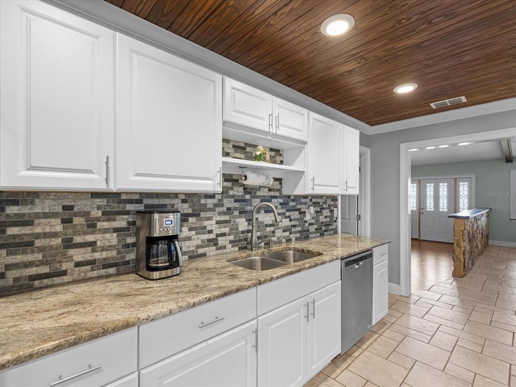 5904 Springrun Court Holiday, FL 34690 - Photo 19 of 53 a kitchen with sink and cabinets