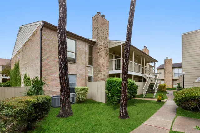 a front view of a building with garden