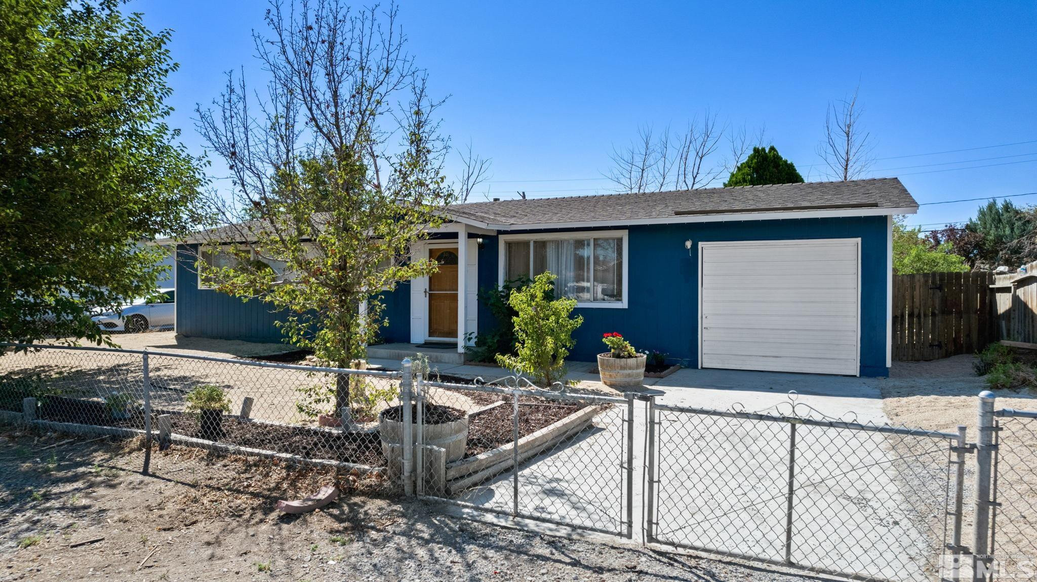 335 West Cedar Street Fernley, NV 89408 - Photo 1 of 26 a front view of house with yard