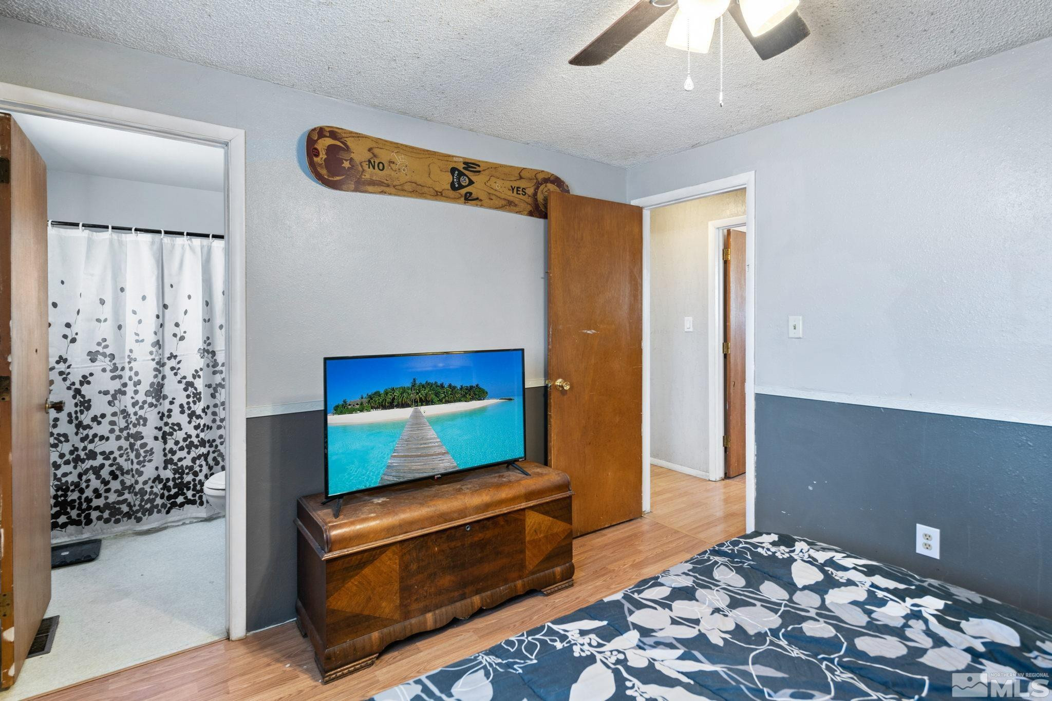 335 West Cedar Street Fernley, NV 89408 - Photo 17 of 26 a bedroom with a bed and a dresser