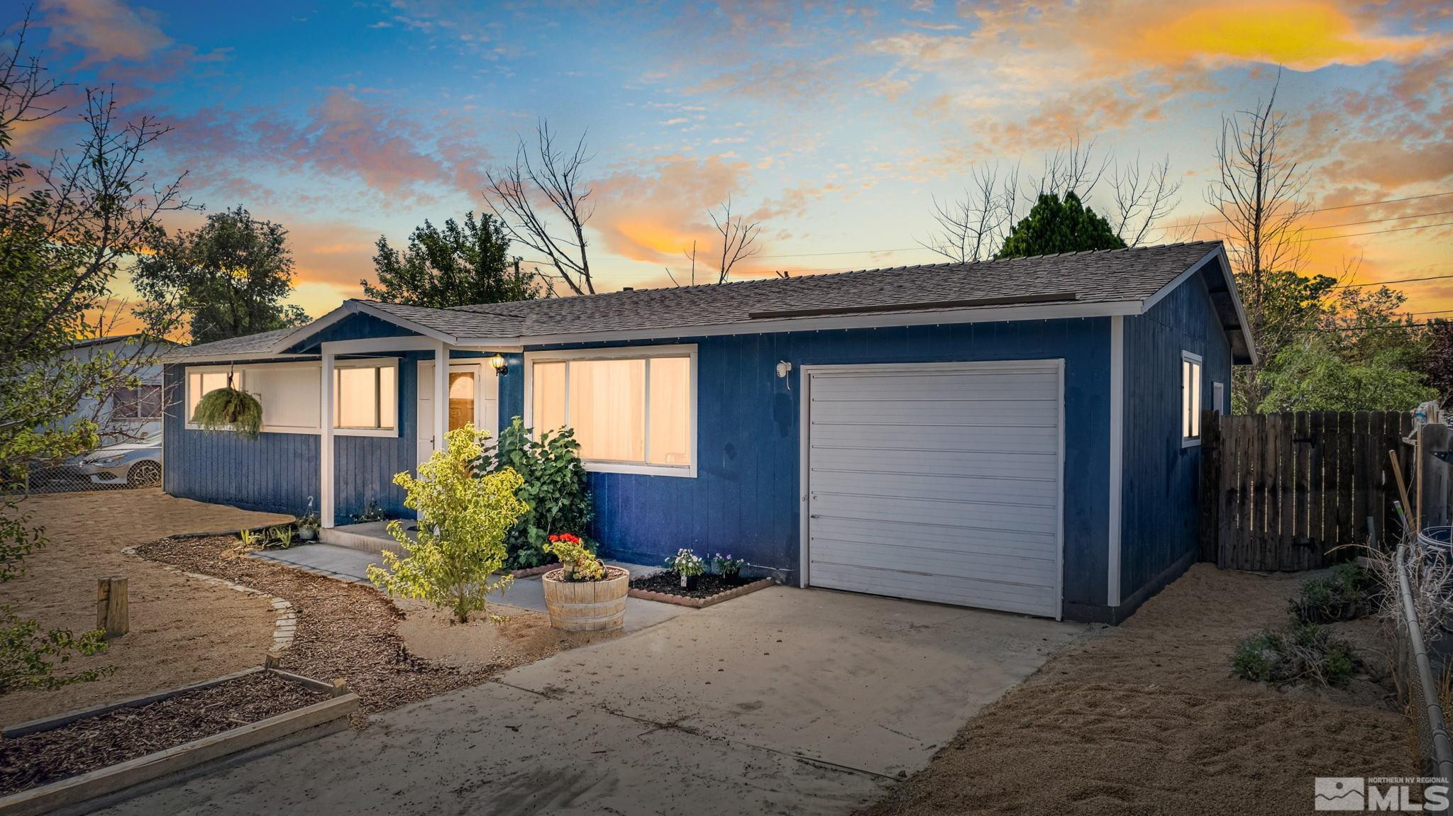 335 West Cedar Street Fernley, NV 89408 - Photo 2 of 26 a front view of a house with a yard