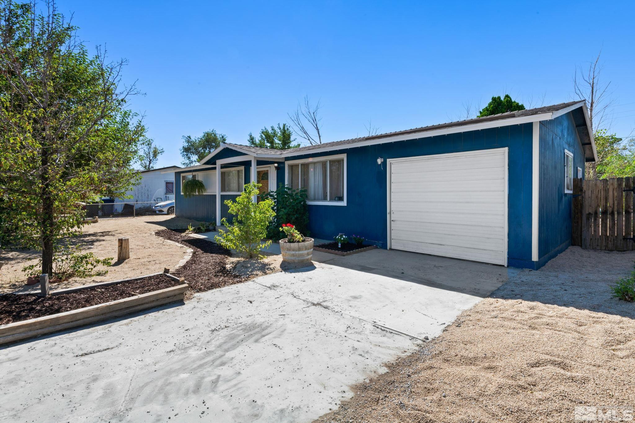 335 West Cedar Street Fernley, NV 89408 - Photo 3 of 26 a front view of house with yard