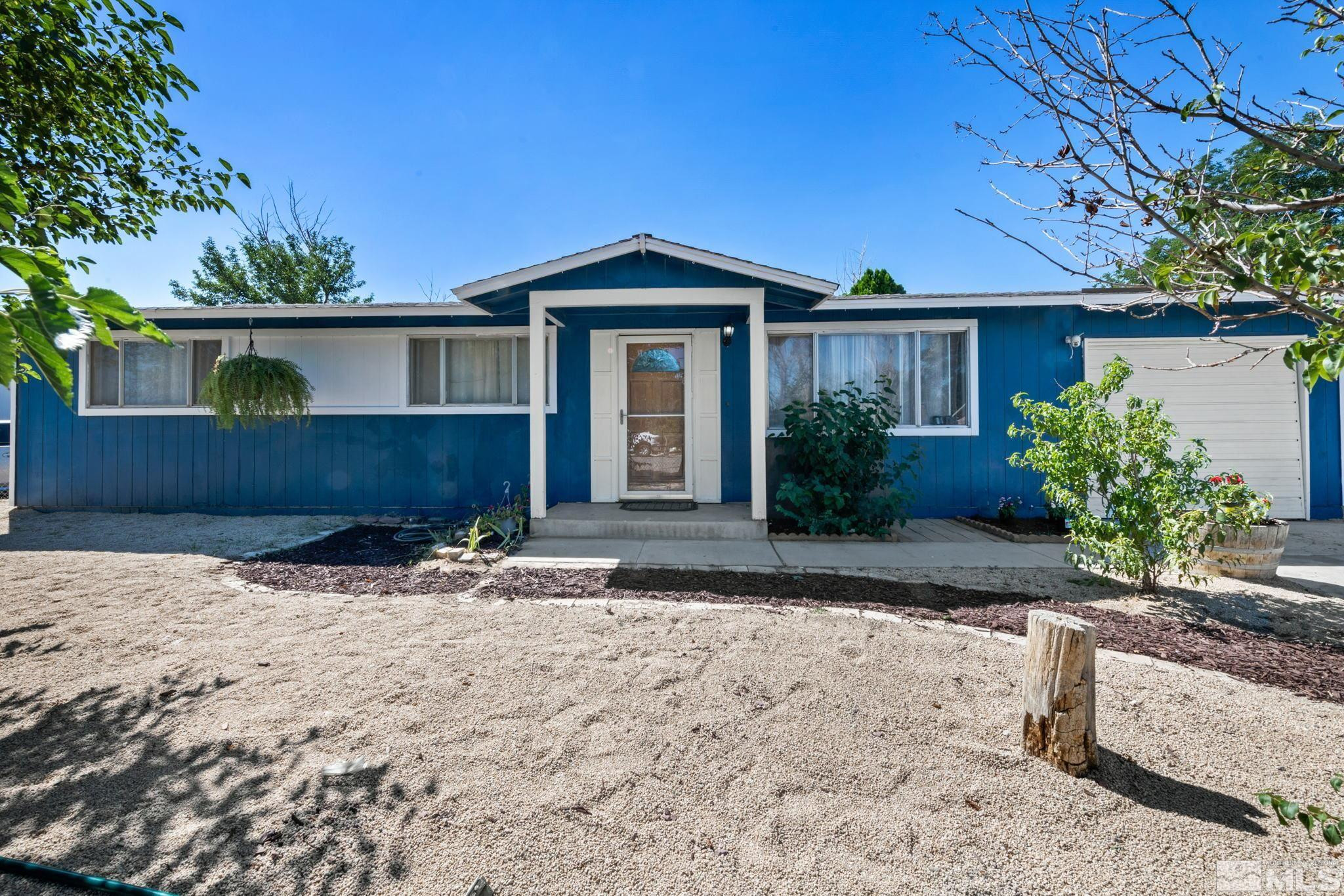 335 West Cedar Street Fernley, NV 89408 - Photo 6 of 26 a front view of a house with a yard