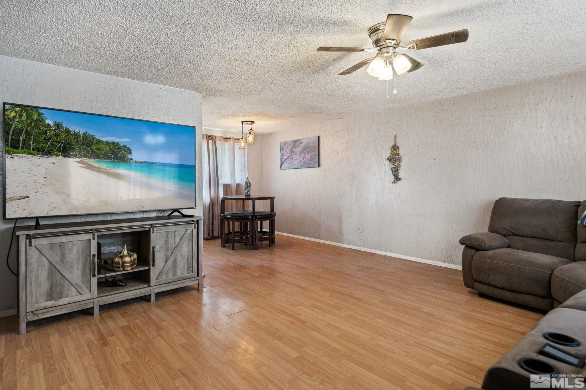 335 West Cedar Street Fernley, NV 89408 - Photo 8 of 26 a living room with furniture and a fireplace