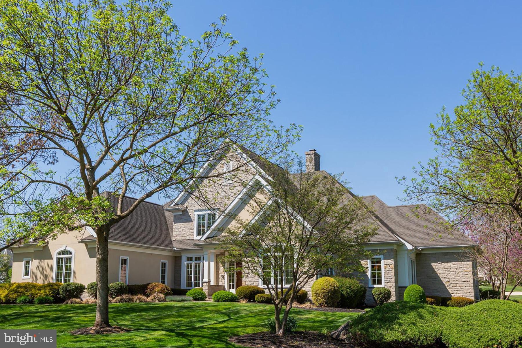 801 Greenside Drive Lititz, PA 17543 - Photo 2 of 57 a front view of a house with a garden and trees