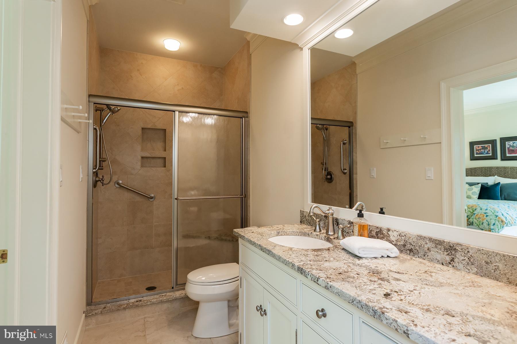 801 Greenside Drive Lititz, PA 17543 - Photo 32 of 57 a bathroom with a granite countertop sink toilet and shower