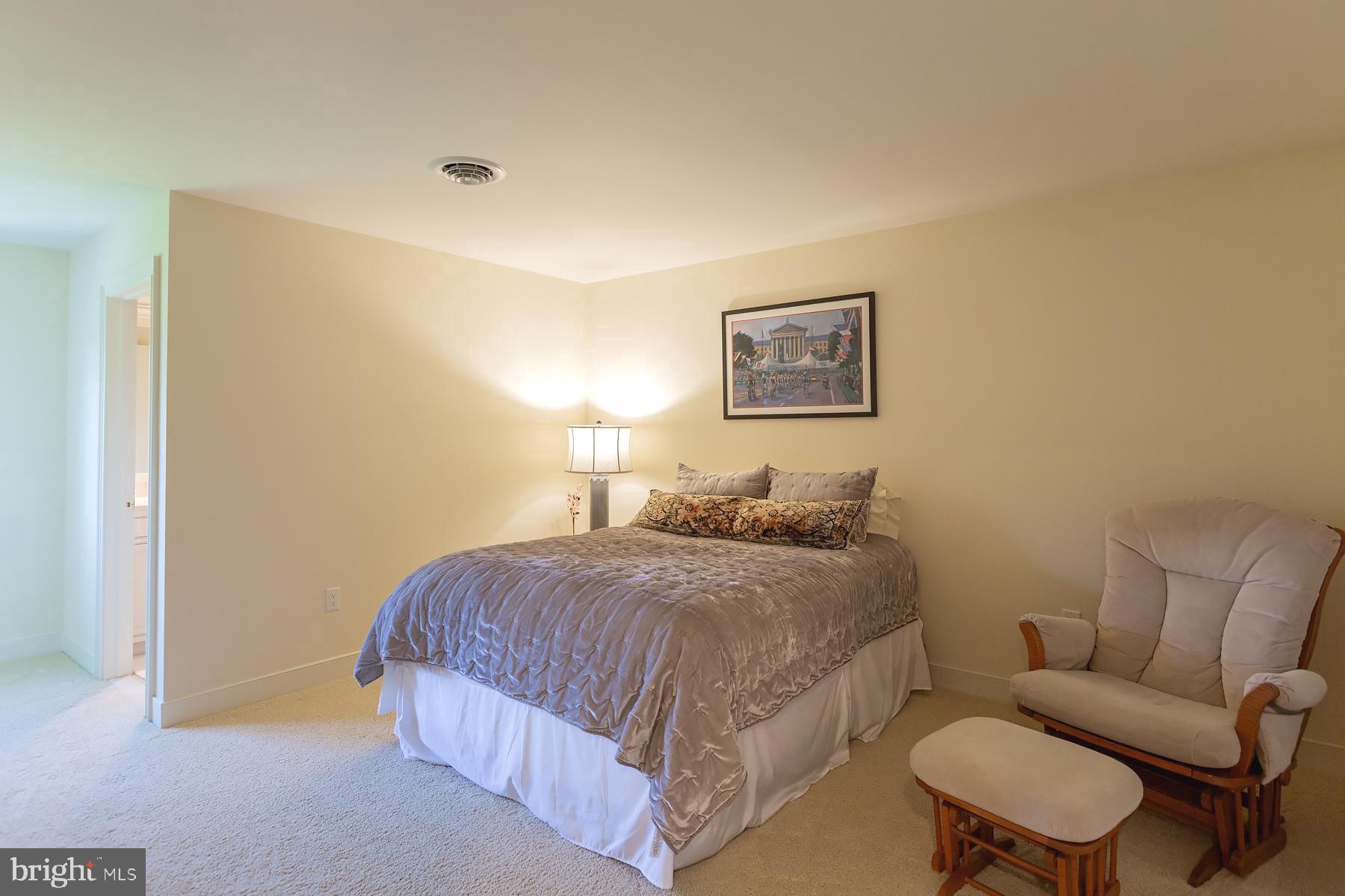 801 Greenside Drive Lititz, PA 17543 - Photo 40 of 57 a bedroom with a bed and a chair