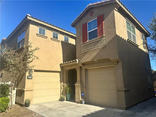 a front view of a house with a garage