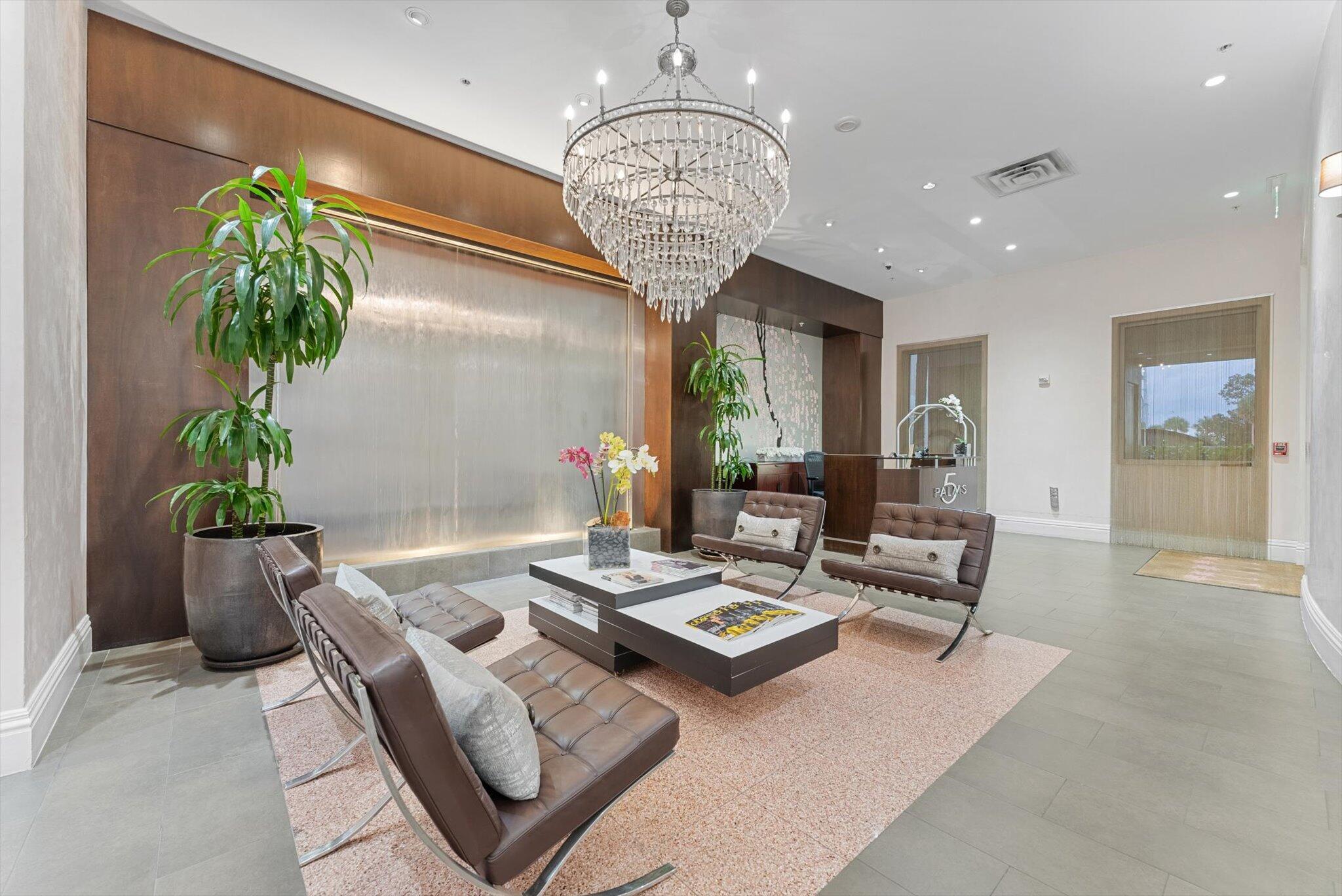 455 East Palmetto Park Road, Unit 6E Boca Raton, FL 33432 - Photo 24 of 28 a living room with furniture and a chandelier