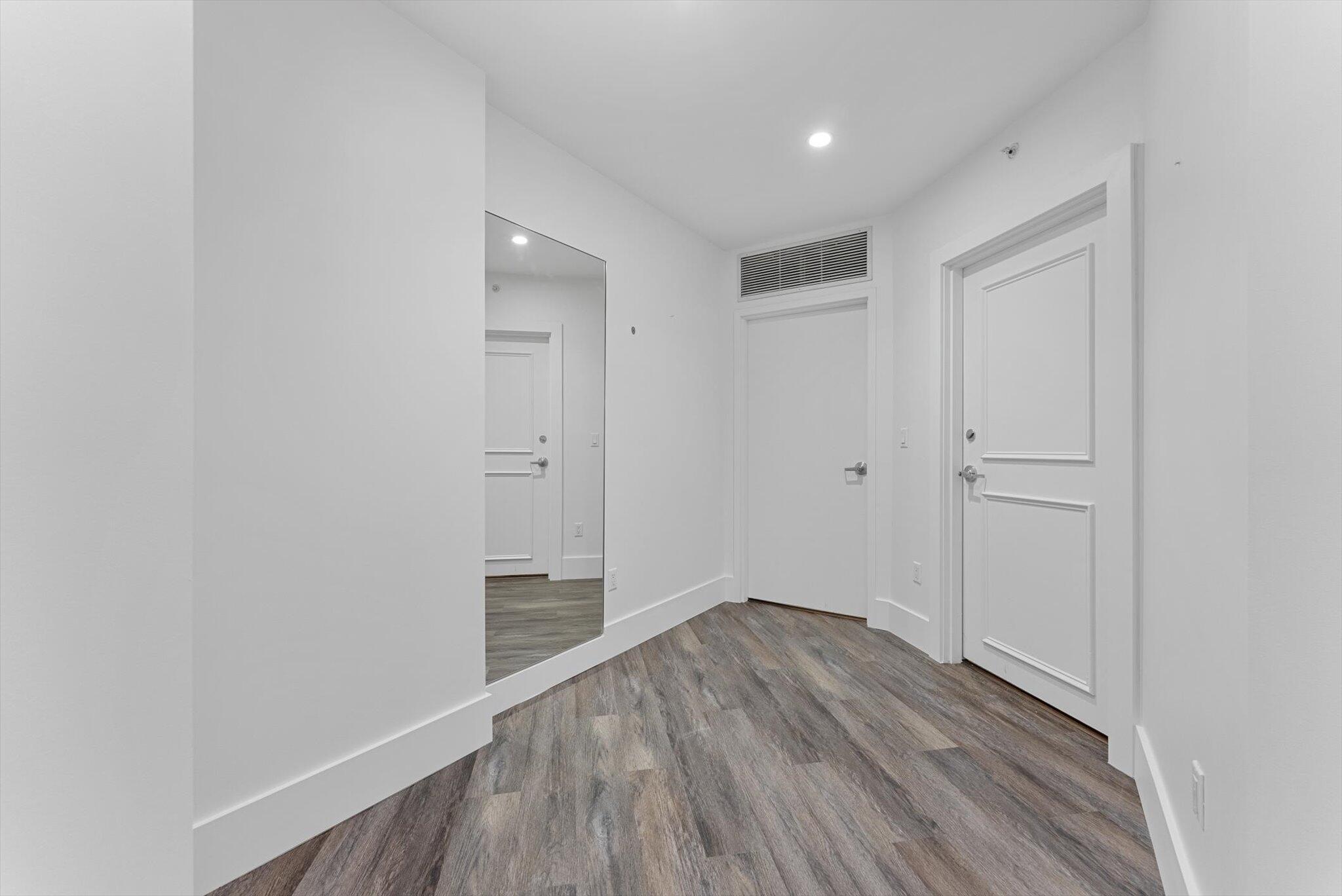 455 East Palmetto Park Road, Unit 6E Boca Raton, FL 33432 - Photo 3 of 28 a view of a hallway with wooden floor