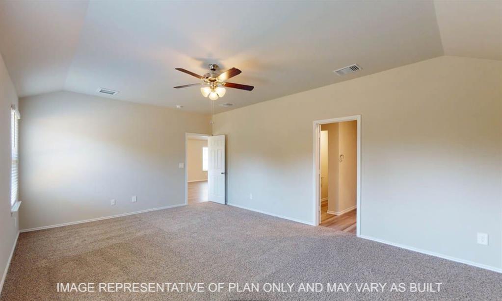 10204 Neptune Court Waco, TX 76708 - Photo 13 of 20 Spacious room featuring vaulted ceilings, neutral-toned carpeting, a ceiling fan with integrated lighting, and multiple windows