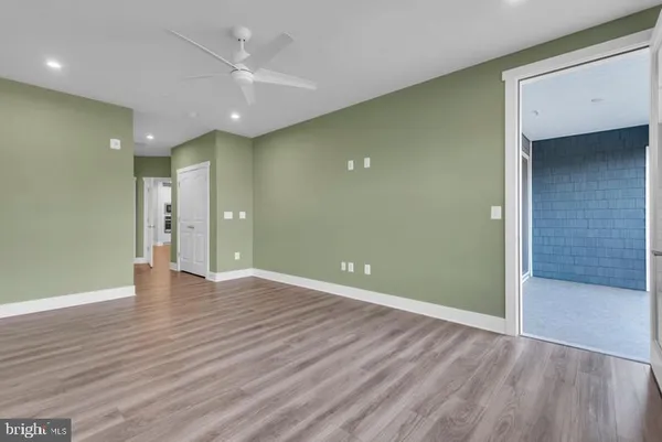 a bathroom with a sink toilet vanity and shower