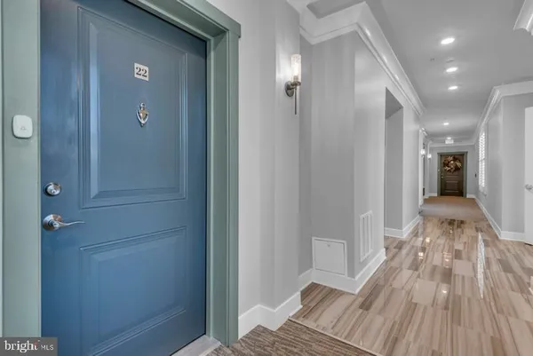 a view of room with window and wooden floor