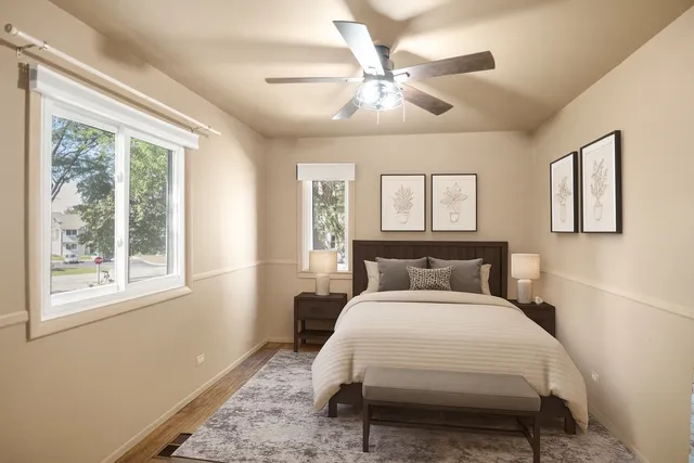 a bedroom with a large bed and a window