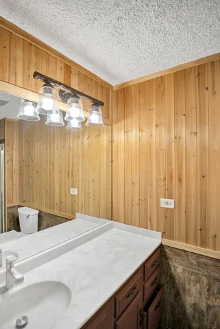 a bedroom with a bed and a table