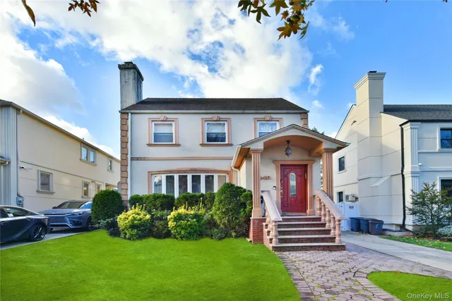 a front view of a house with garden