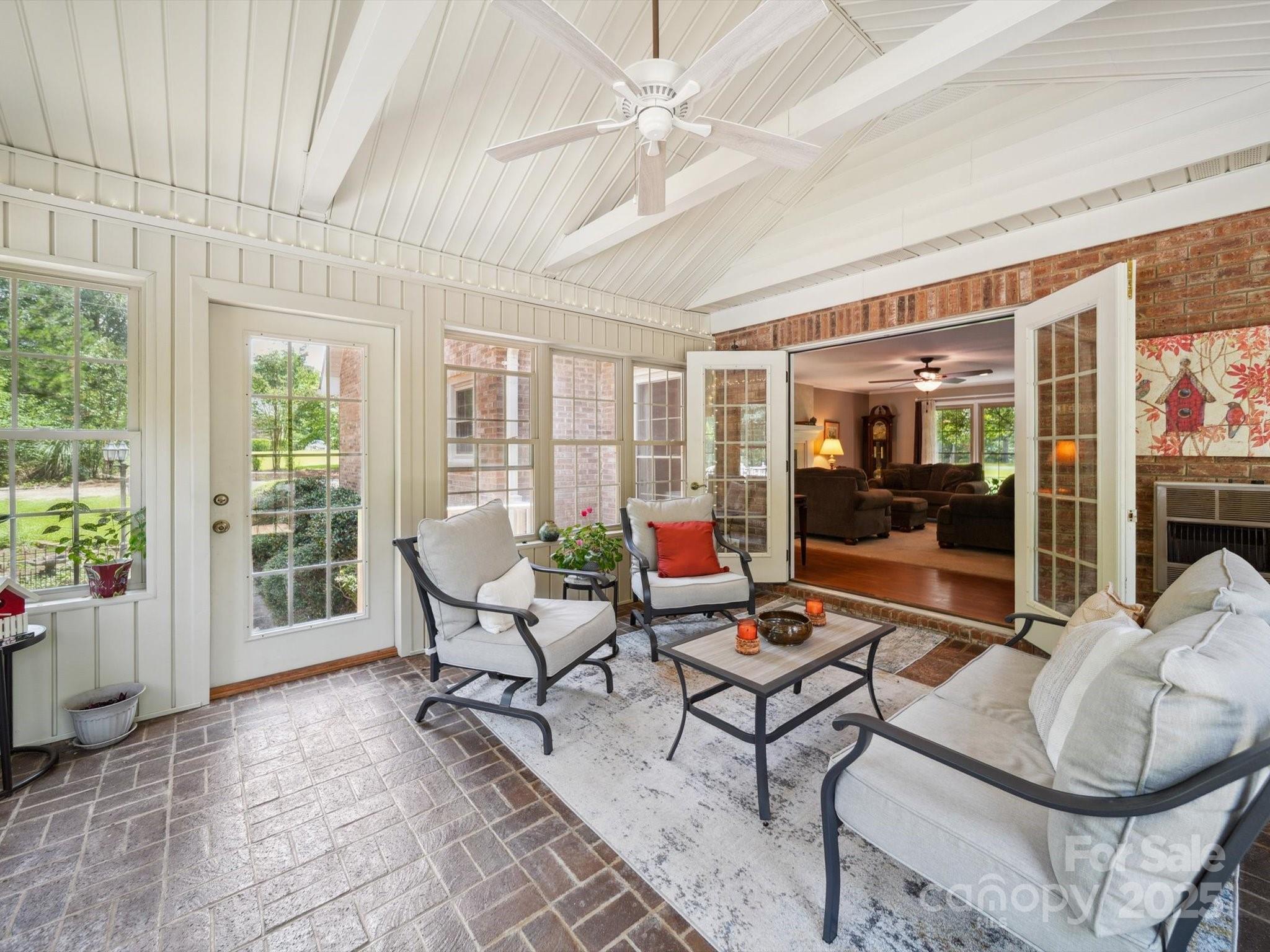 394 Gold Mine Road Wadesboro, NC 28170 - Photo 18 of 39 a living room with furniture and a floor to ceiling window