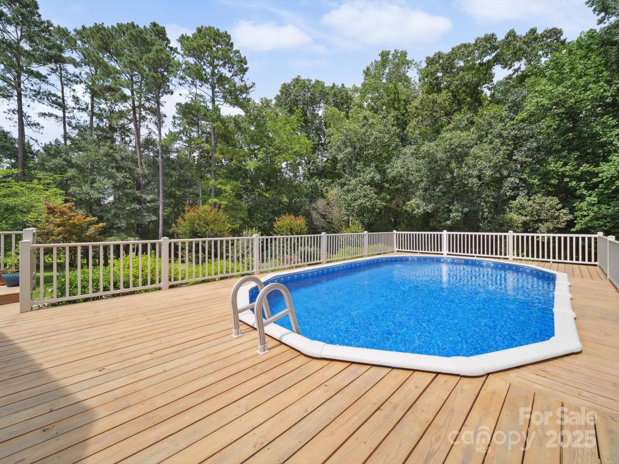 394 Gold Mine Road Wadesboro, NC 28170 - Photo 6 of 39 a view of a swimming pool with a lounge chair