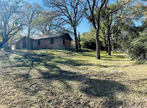a view of a livingroom with wooden floor and a ceiling fan