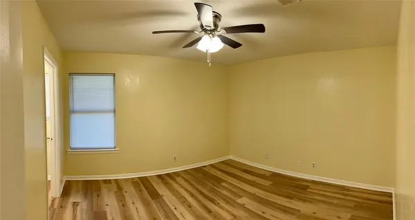 a bathroom with a sink mirror and toilet