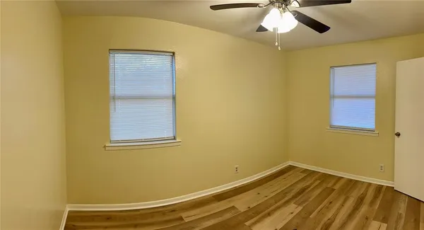 a view of a room with a ceiling fan