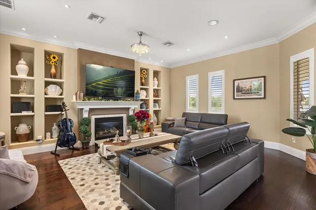 a living room with furniture dining table and a window