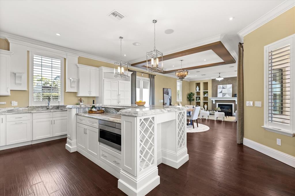 812 Stephens Pass Cove Lake Mary, FL 32746 - Photo 12 of 60 a kitchen with stainless steel appliances granite countertop a stove and cabinets