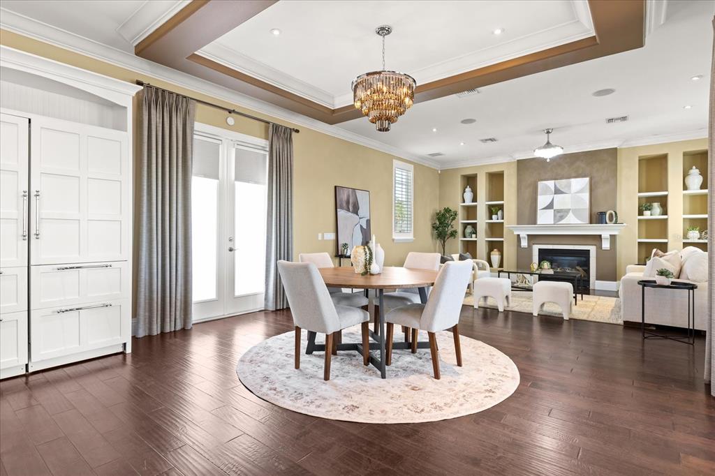 812 Stephens Pass Cove Lake Mary, FL 32746 - Photo 14 of 60 a view of a dining room with furniture wooden floor and chandelier