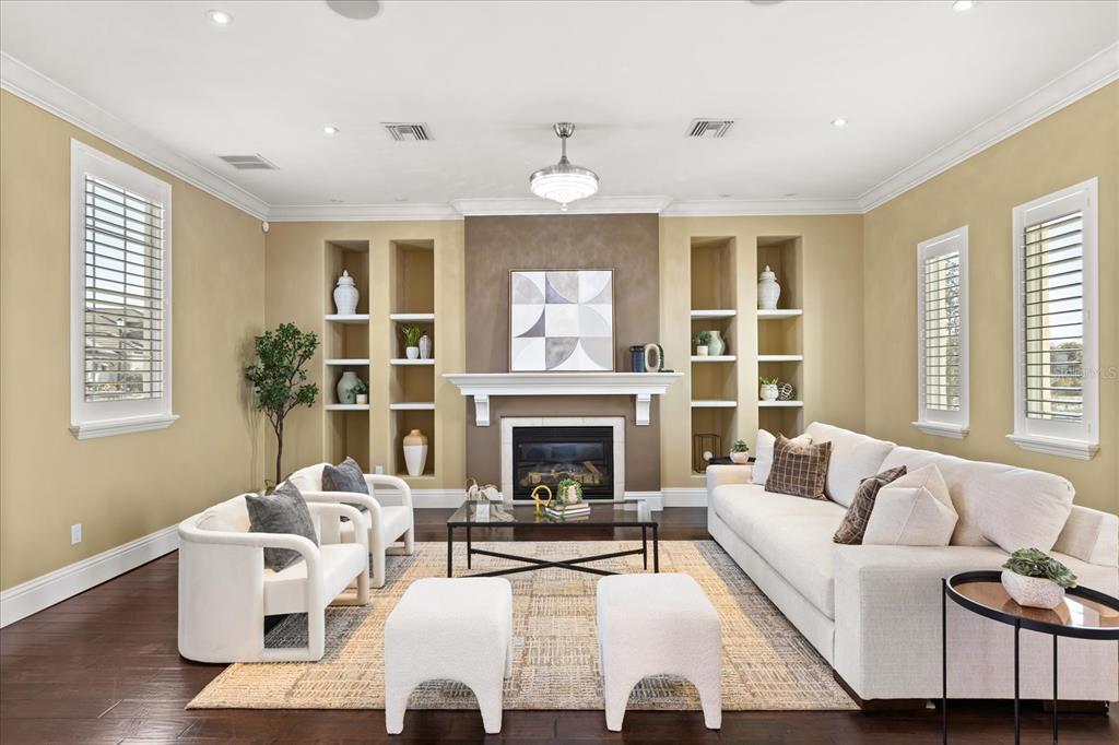 812 Stephens Pass Cove Lake Mary, FL 32746 - Photo 17 of 60 a living room with furniture fireplace and window