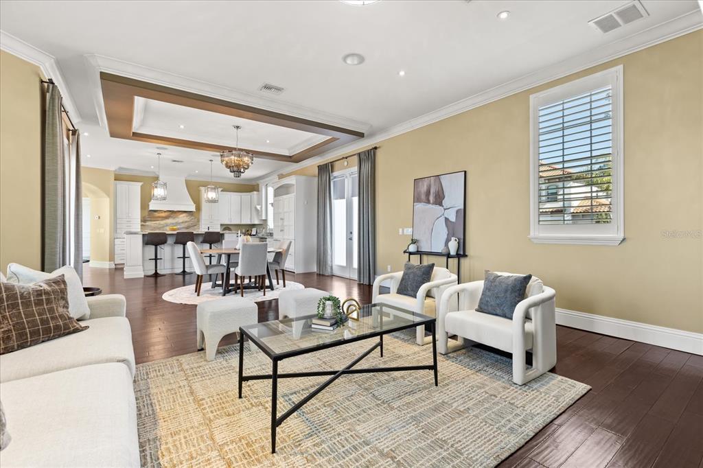 812 Stephens Pass Cove Lake Mary, FL 32746 - Photo 18 of 60 a living room with furniture and a wooden floor