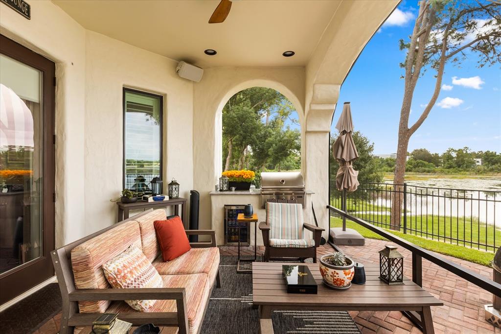 812 Stephens Pass Cove Lake Mary, FL 32746 - Photo 22 of 60 a living room with furniture floor to ceiling window and wooden floor