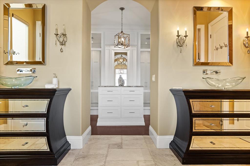 812 Stephens Pass Cove Lake Mary, FL 32746 - Photo 31 of 60 a bathroom with a sink a mirror and a shower