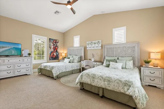 a bedroom with a bed and a desk