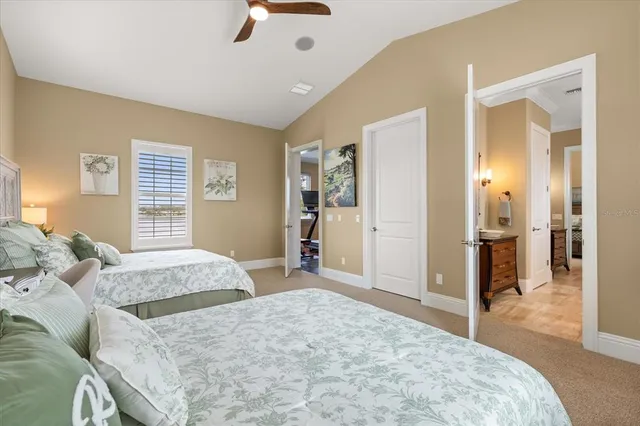 a bedroom with a bed and a desk