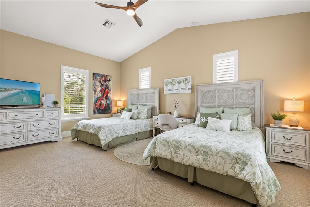 812 Stephens Pass Cove Lake Mary, FL 32746 - Photo 40 of 60 a bedroom with two beds and a window