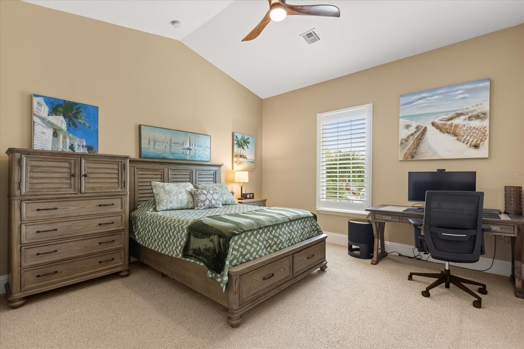 812 Stephens Pass Cove Lake Mary, FL 32746 - Photo 44 of 60 a bedroom with a bed and a desk